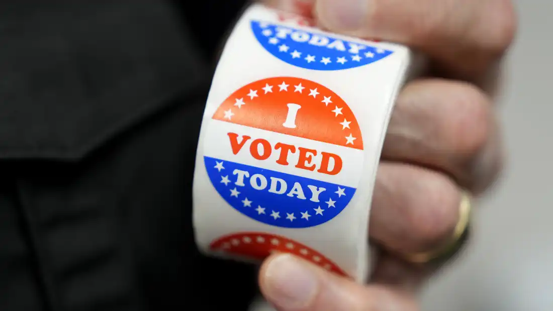 A worker holds I Voted Today stickers during early voting on October 14, 2026 in Des Moines, Iowa.