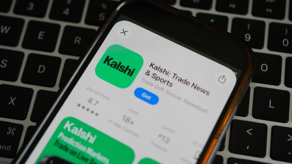 An iPhone displaying the Kalshi app as being available for download.