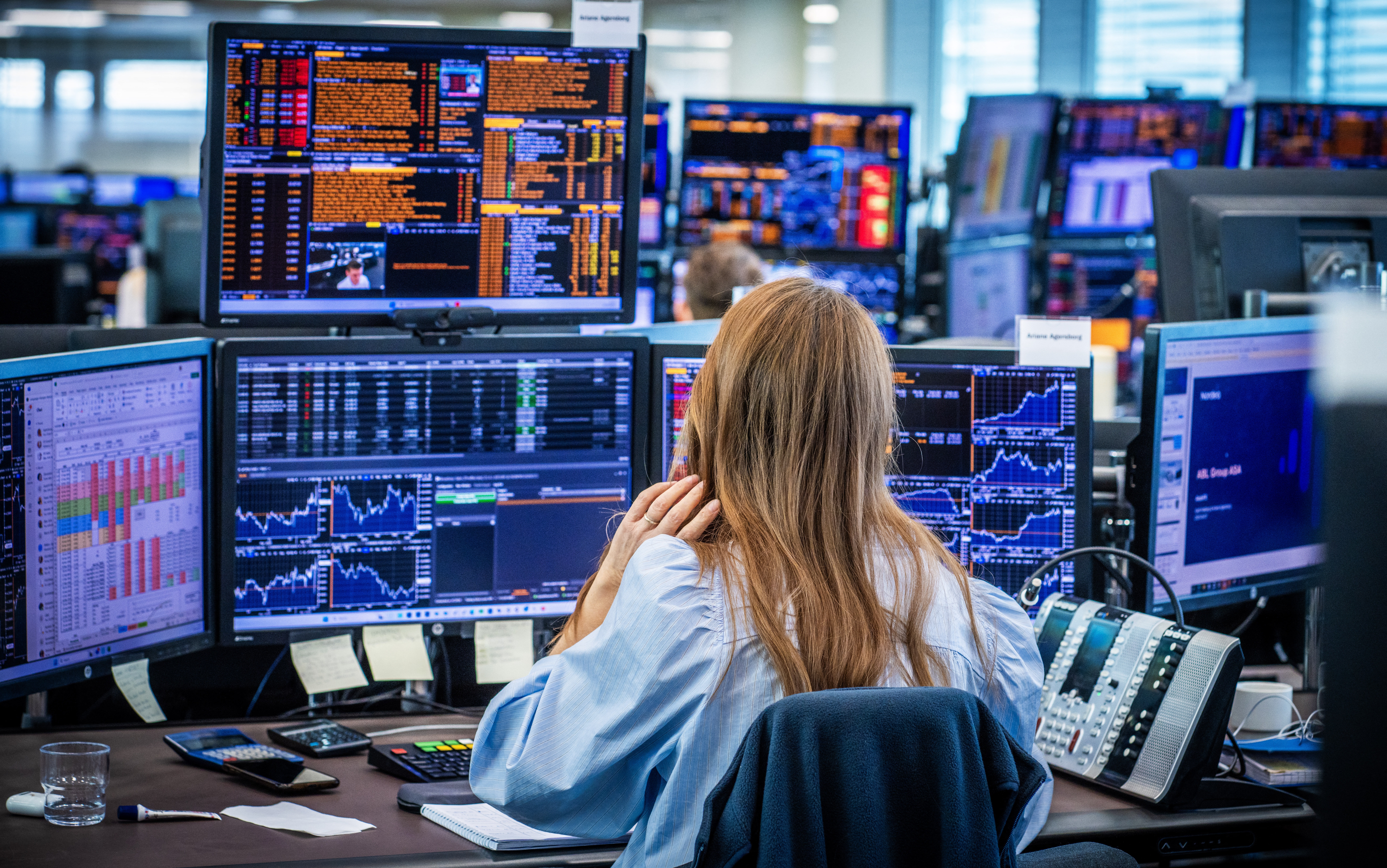 Employees in the trading room of Nordea Markets follow Monday