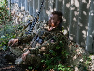 A Ukrainian serviceman rests in the front-line town of Druzhkivka in eastern Ukraine on Sept. 12. Troops often serve for extended periods in front-line positions because it is difficult and dangerous to rotate troops in and out.