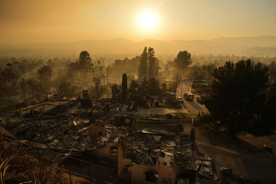 An emergency vehicle drives through a neighborhood devastated by the Eaton Fire, Thursday, Jan. 9, 2025, in Altadena, Calif.