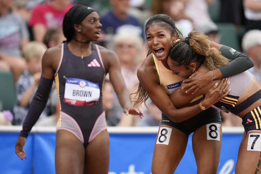 Gabby Thomas celebrates after winning the women's 200-meter final with third place winner McKenzie Long during the U.S. Track and Field Olympic Team Trials Saturday, June 29, 2024, in Eugene, Ore. 