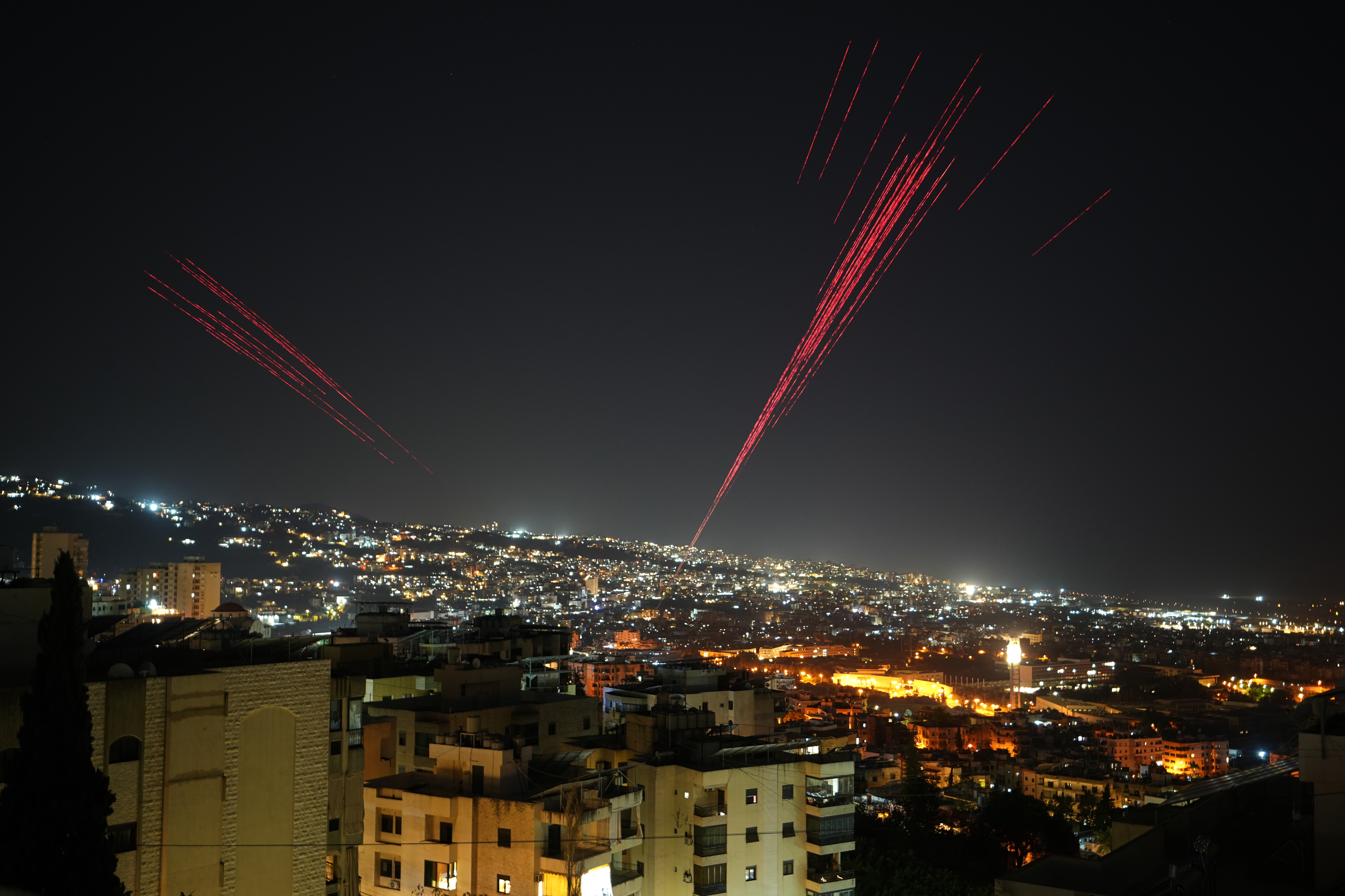 Tracer rounds illuminate the night sky as people fire live ammunition and fireworks into the air as a ceasefire was beginning between Israel and Hezbollah, in Beirut, Lebanon, in the early hours of Friday.