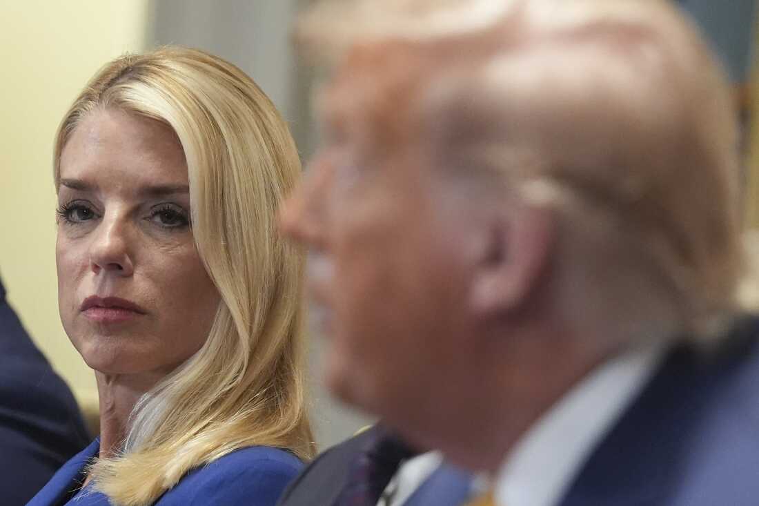 Attorney General Pam Bondi, left, listens as President Donald Trump, right, speaks during a cabinet meeting at the White House.