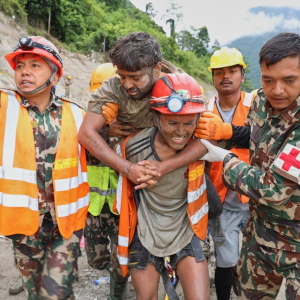 In this photo provided by the Nepal Army, soldiers rescue a worker alive from a tunnel during an ongoing operation at the Trishuli-3A hydropower project in Nepal's Rasuwa district, Friday, Sept. 4, 2026.