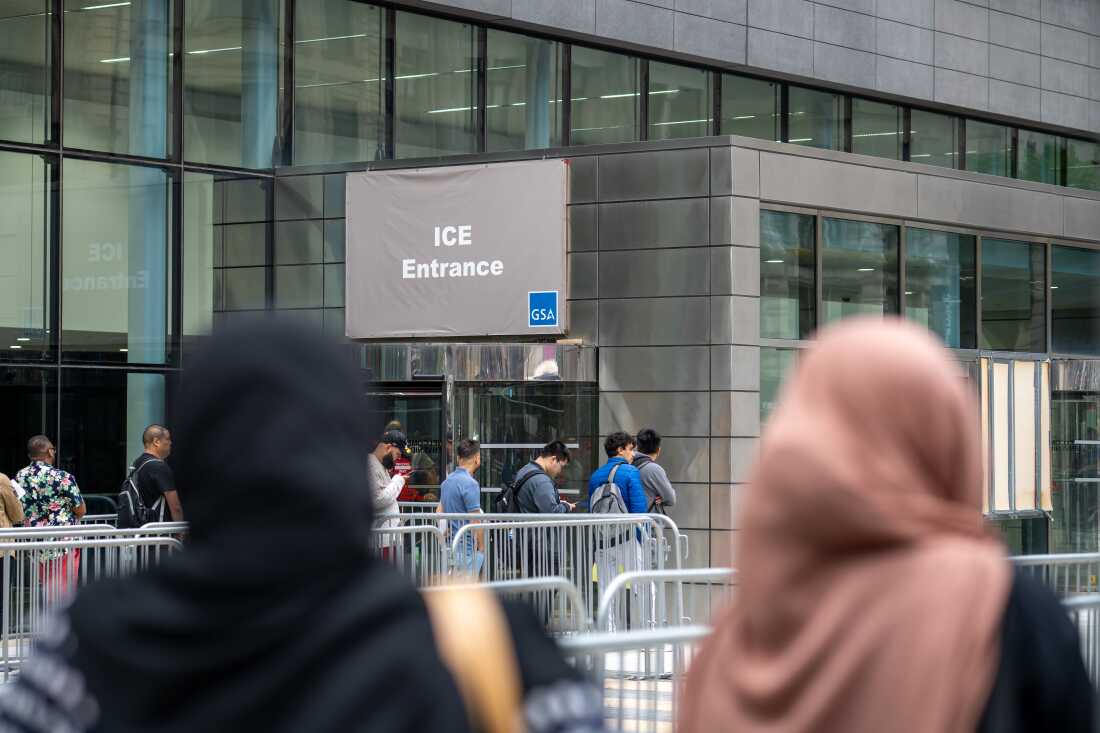 People line up outside 26 Federal Plaza to attend their immigration and naturalization hearings.