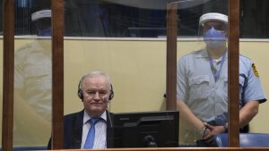 Former Bosnian Serb military chief Ratko Mladic sits in the court room in The Hague, Netherlands, June 8, 2021, where the United Nations court delivers its verdict in the appeal of Mladic against his convictions for genocide and other crimes and his life sentence for masterminding atrocities throughout the Bosnian war.