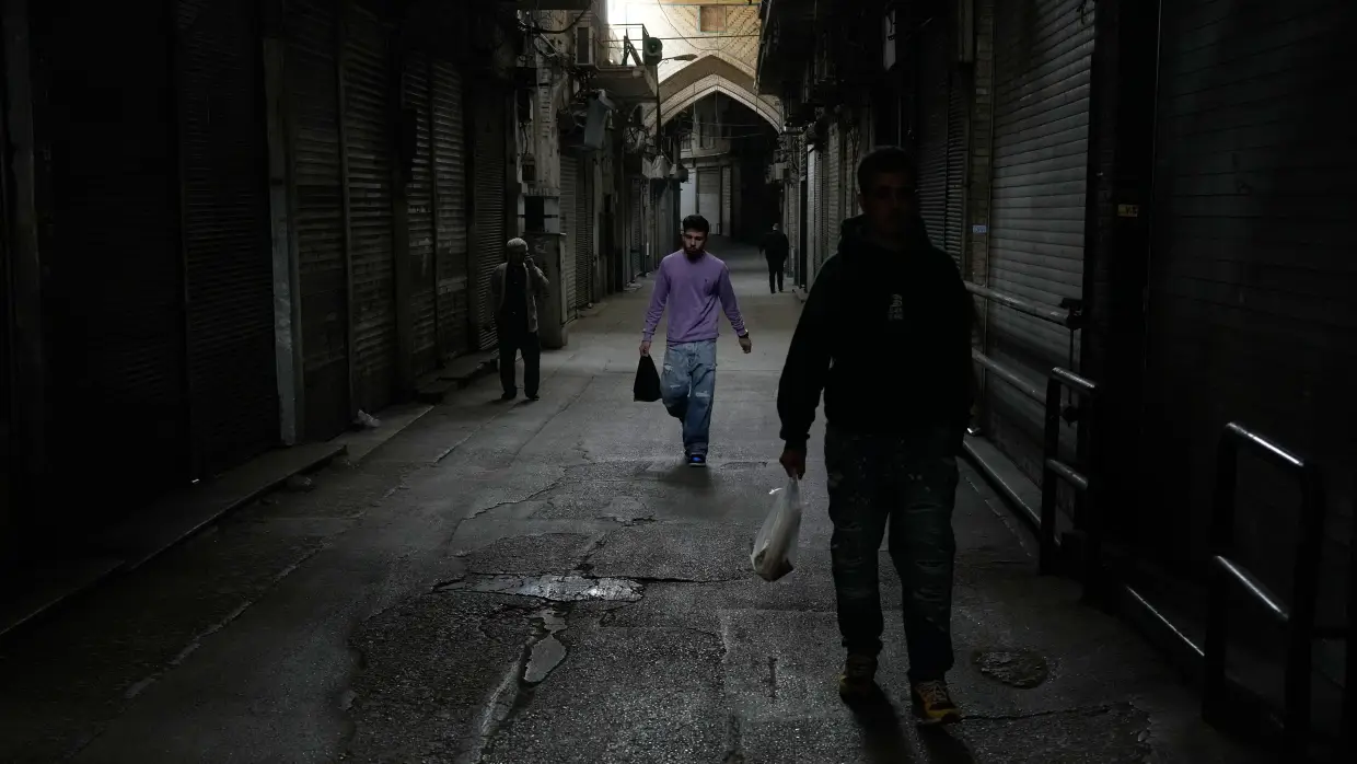 Amid war and sanctions, many Iranians are losing their jobs and struggling to get by