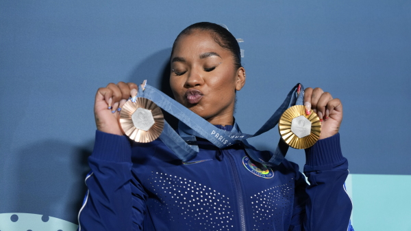 U.S.'s Jordan Chiles holds up her medals after the gymnastics finals on Monday. Her bronze, on the left, which she won during the floor exercise might be taken away.