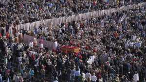The body of Pope Francis is carried through St. Peter's Square to St. Peter's Basilica at the Vatican on Wednesday.