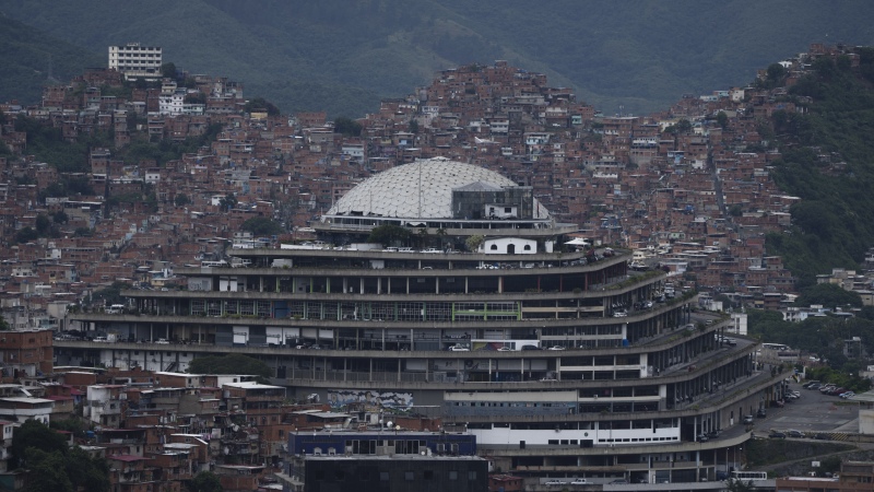 Venezuela's National Intelligence Service (SEBIN) headquarters, known as El Helicoide, stands in front of La Cota 905 neighborhood in Caracas, Venezuela, Sept. 12, 2022. 