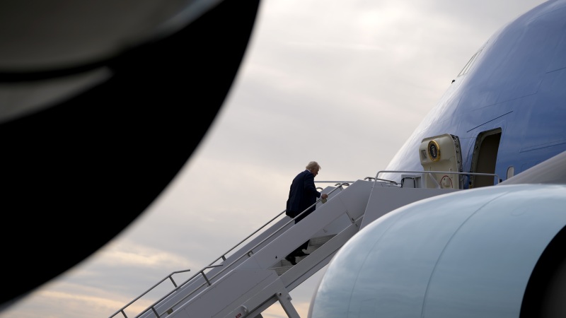 President Donald Trump boards Air Force One en route to Florida at Harry Reid International Airport in Las Vegas, on Saturday.
