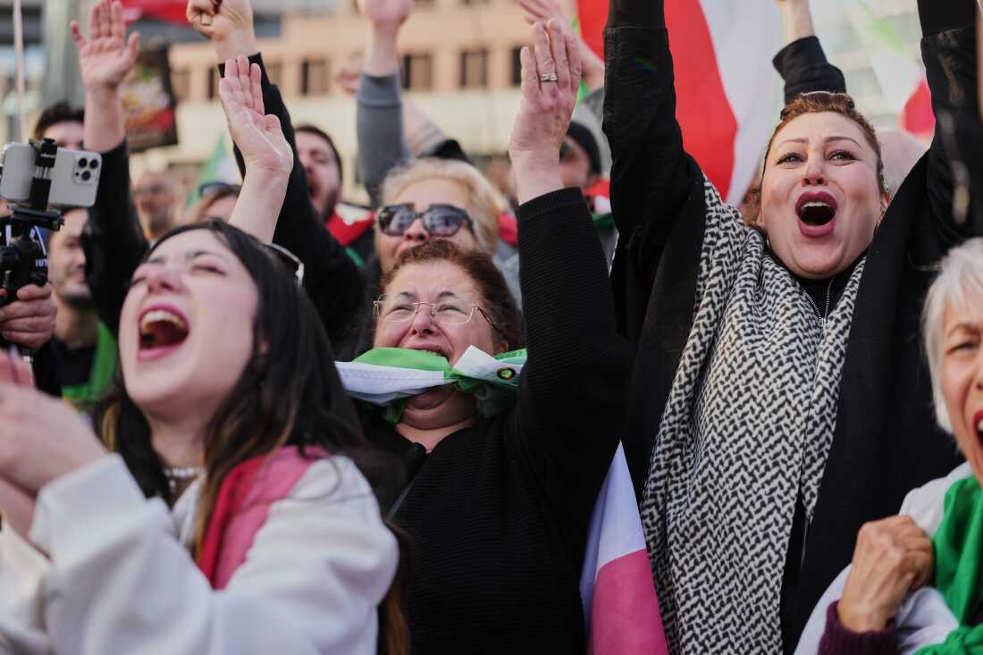 Iranian people attend a demonstration in support U.S. and Israeli strikes on Iran, in Berlin, Germany, Saturday, Feb. 28, 2026. 
