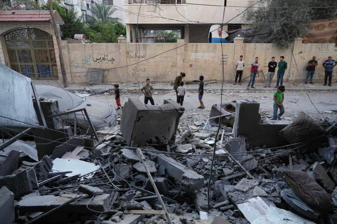 Palestinians inspect the site of an early morning Israeli airstrike in Gaza city, Saturday, Oct. 3, 2026.