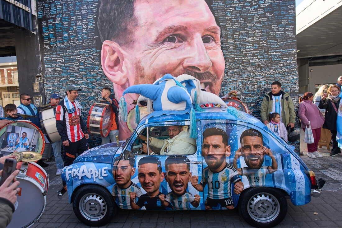 People sing happy birthday to Lionel Messi at a street mural of him in Buenos Aires, Argentina, June 24.