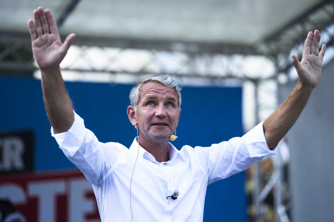 Bjoern Hoecke top candidate in Thuringia of the far-right Alternative for Germany, AfD, party waves to supporters during an election campaign rally in Suhl, Germany, Aug. 13.