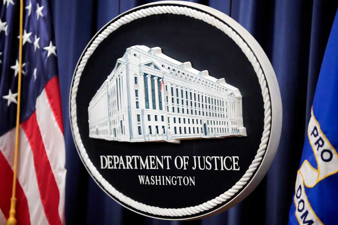The logo for the Justice Department is seen before a news conference at the Department of Justice on Aug. 23, 2024, in Washington.