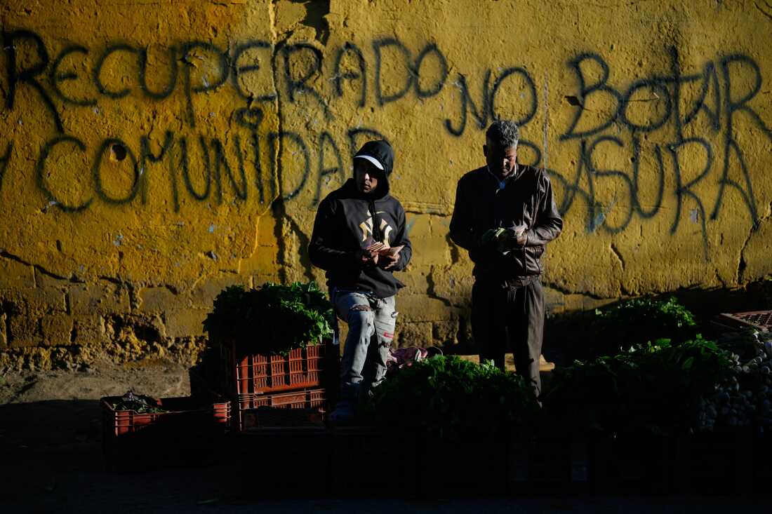 Vendors sell vegetables at an open market in Caracas, Venezuela, Jan. 21, 2026.