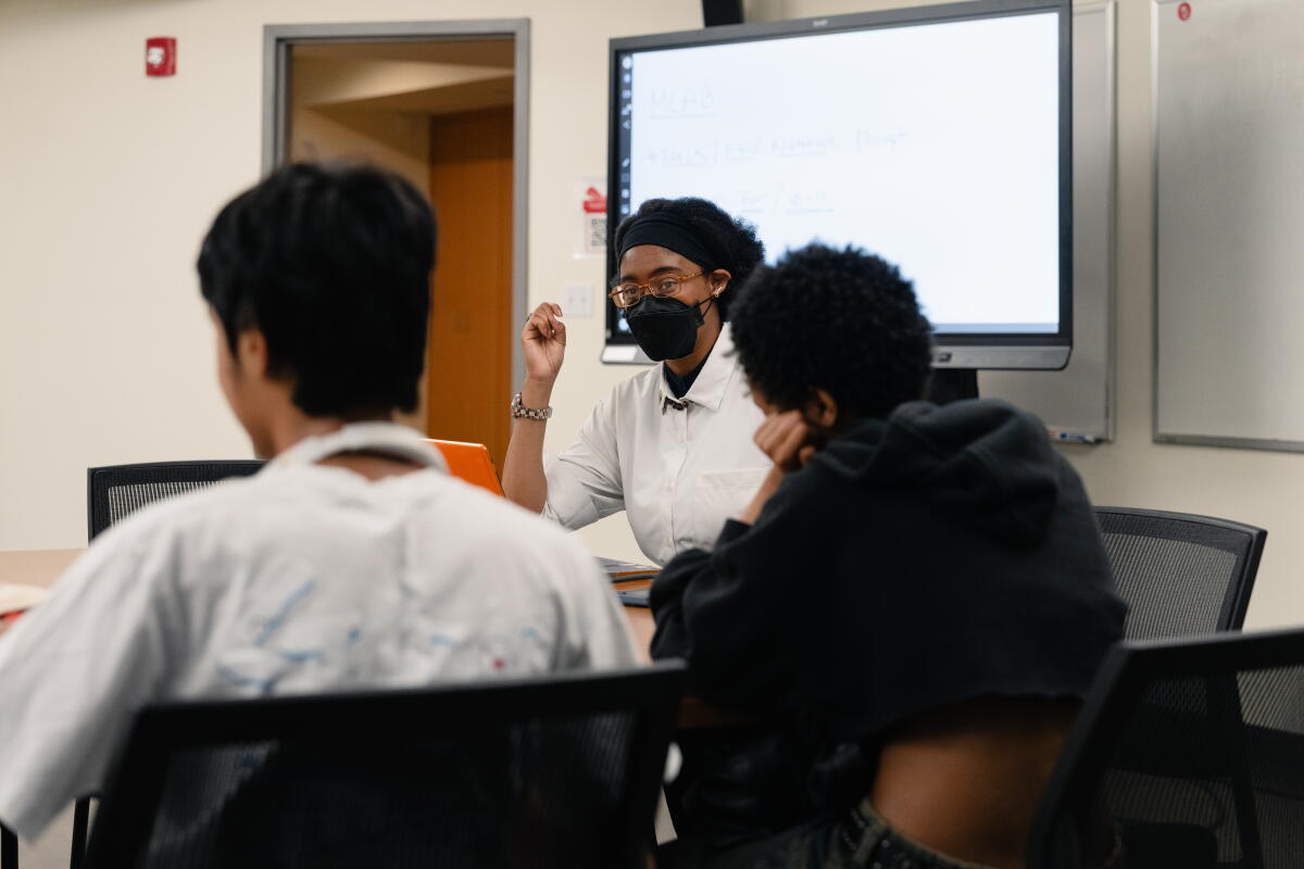 Trump cuts to science advisory boards have long-lasting consequences, researchers say 1 Netia McCray speaks with her students at the Museum of Science.