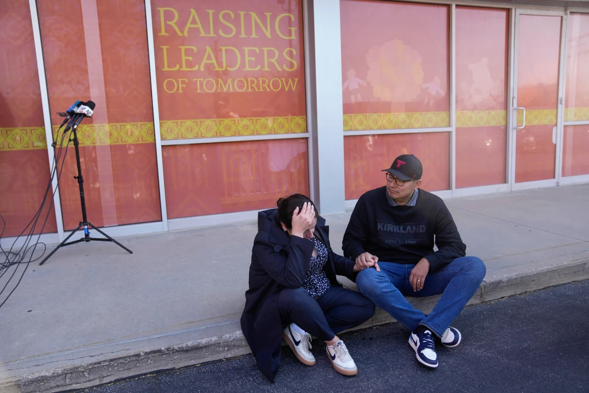 An employee in Rayito de Sol Spanish Immersion preschool in Chicago was taken into federal custody on Nov. 5, 2025. Immigration enforcement at schools and hospitals was against policy under previous presidents. Here, two parents console each other.