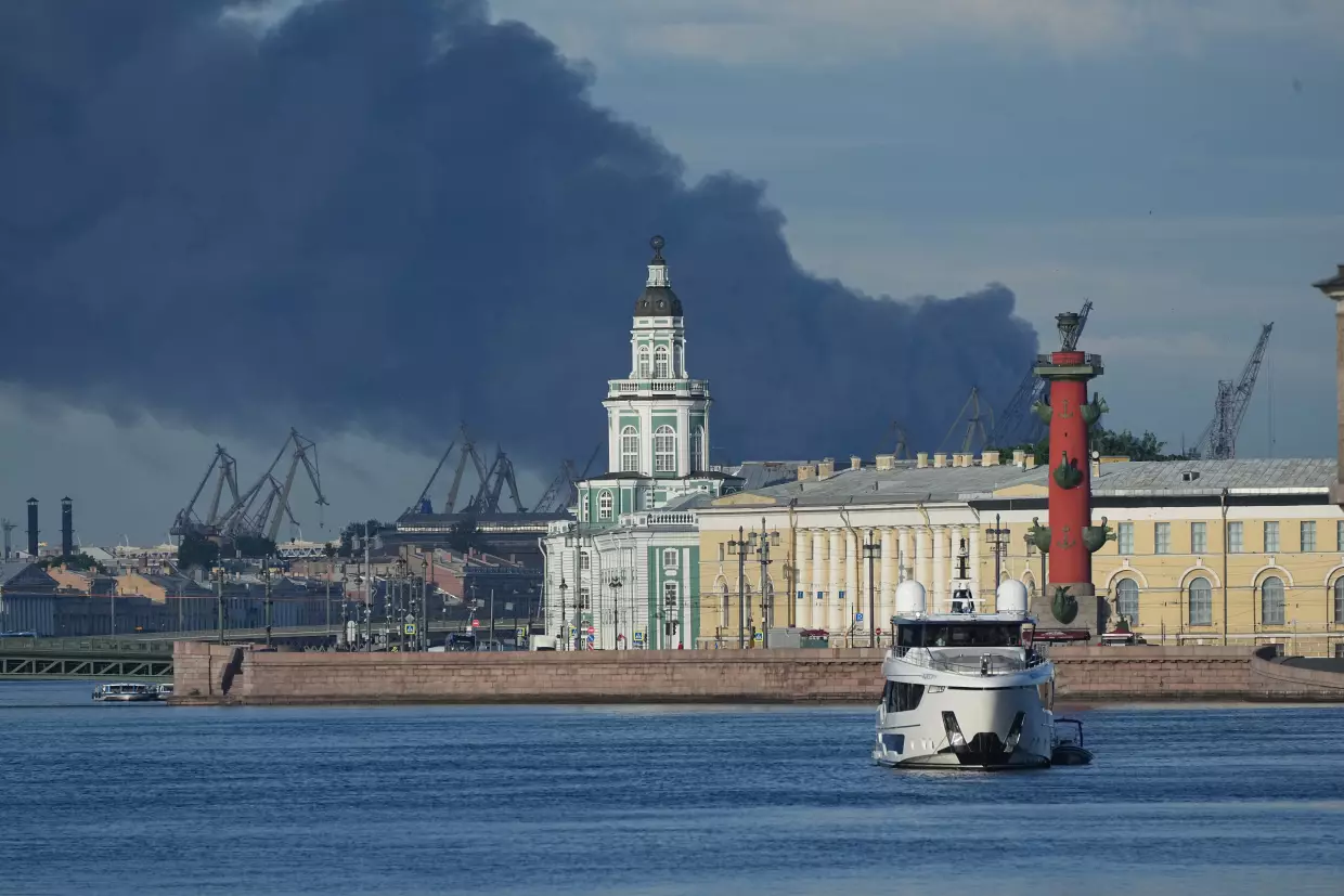 A plumes of black smoke is seen over the port of St. Petersburg, Russia, Wednesday, June 3, 2026, after a Ukrainian drone attack.