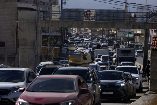 Displaced residents sit in traffic as they return to their villages following a ceasefire between Israel and Hezbollah that went into effect on Wednesday in Ablah, eastern Lebanon.