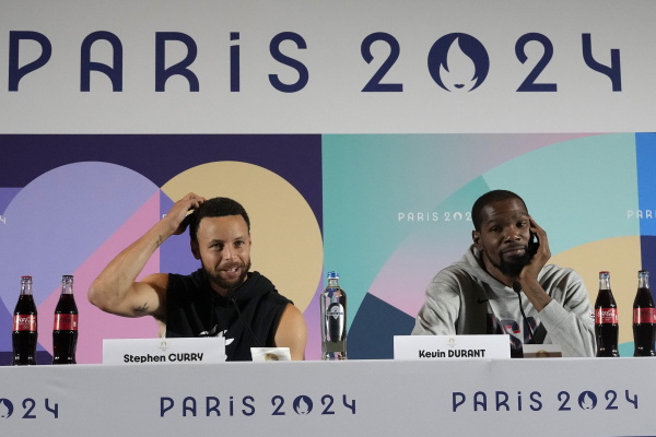 United States men's basketball teammates Kevin Durant, right, and Stephen Curry attend a press conference at the 2024 Summer Olympics on Thursday, in Paris.