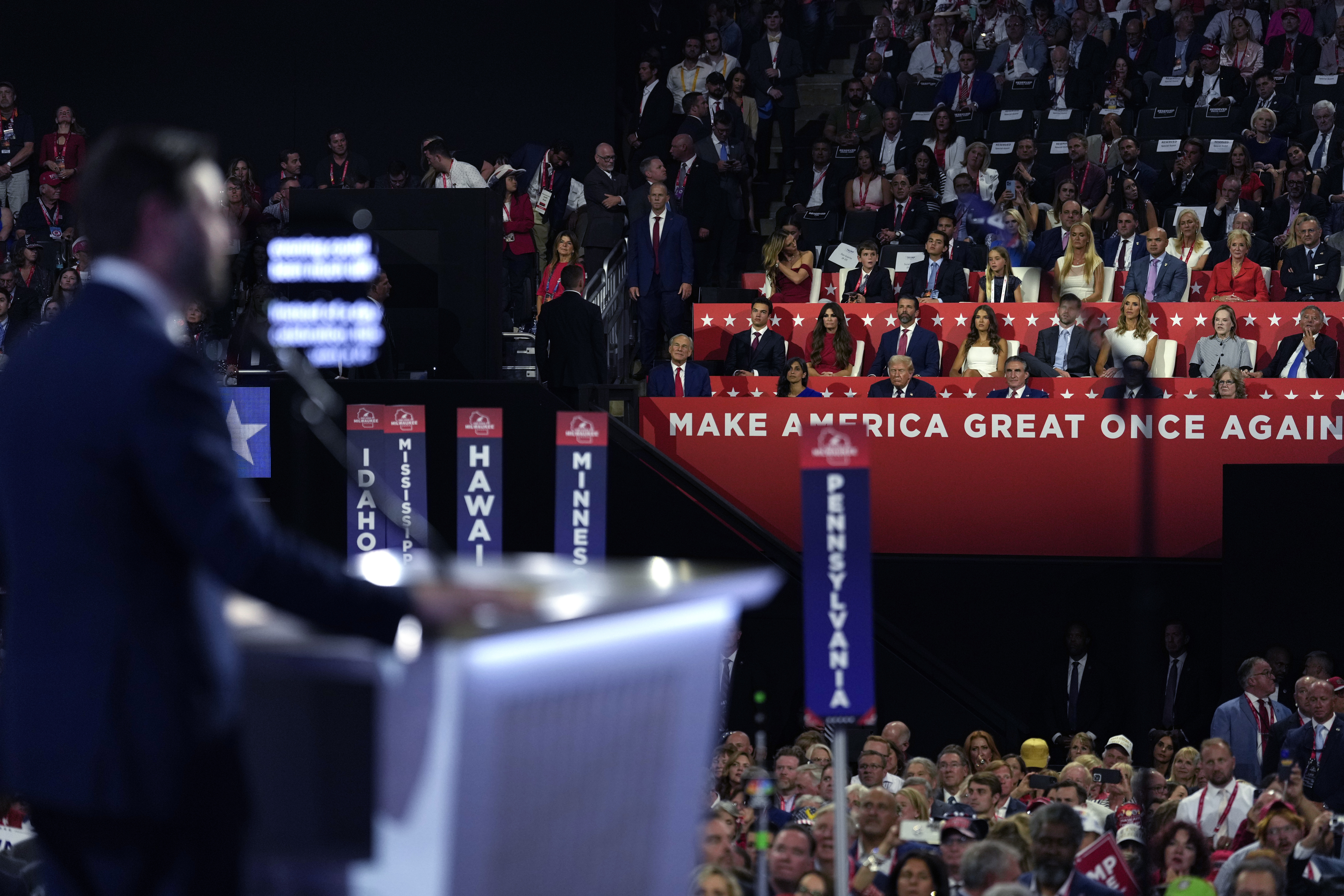 Republican vice presidential candidate Sen. JD Vance, R-Ohio, speaks at the 2024 Republican National Convention on Wednesday in Milwaukee as Republican presidential candidate former President Donald Trump watches. There are more than a dozen so-called "fake electors" from several states serving as delegates at this year