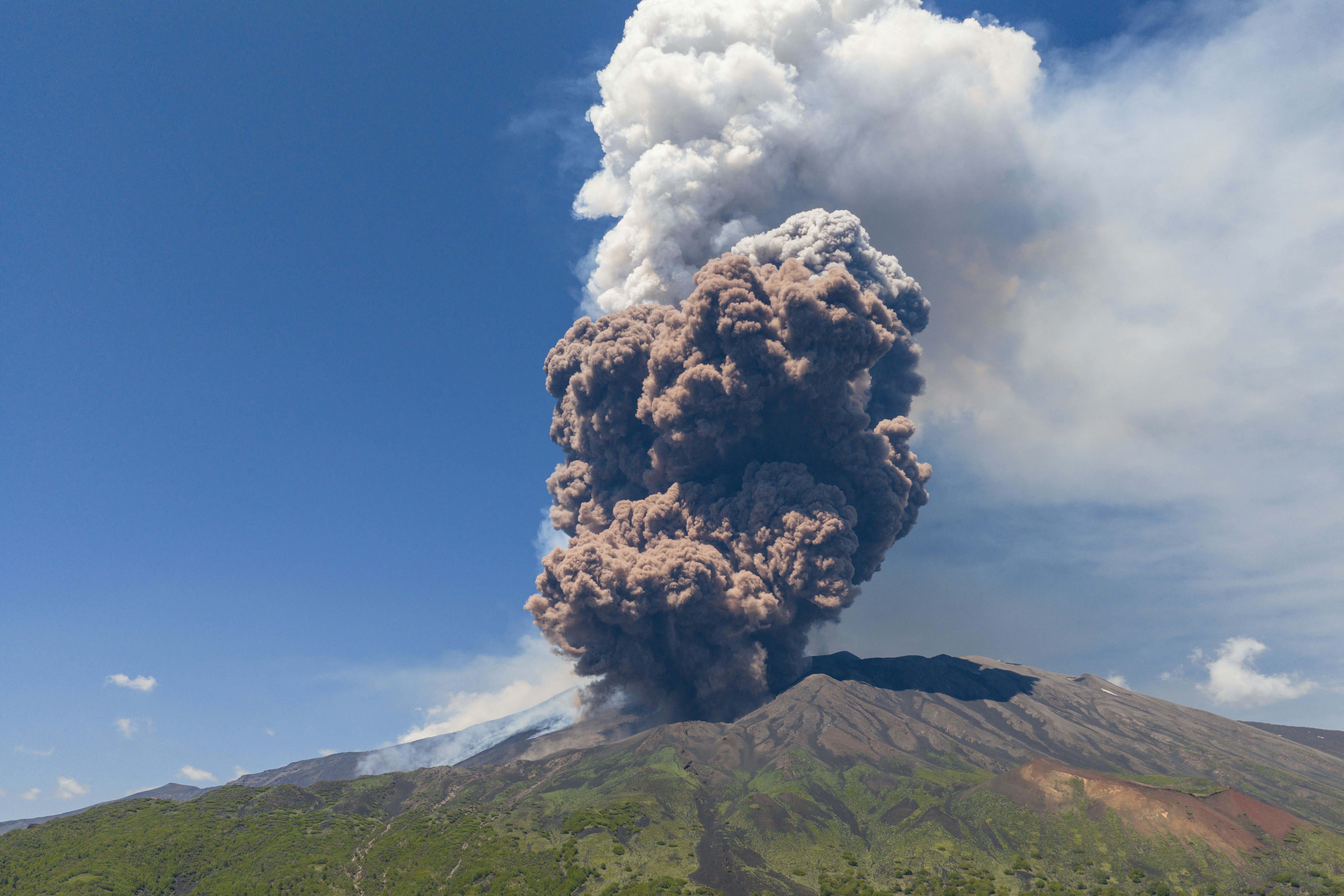 Smoke rises from the crater of the Etna volcano as it erupts, on Mount Etna near Catania, Italy, on Monday. A huge plume of ash, gas and rock spewed forth from Europe