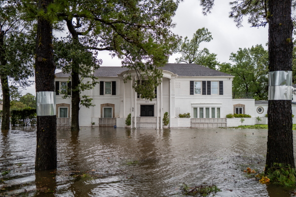 A house in Houston, Texas, is surrounded by floodwater on Monday. Tropical Storm Beryl developed into a Category 1 hurricane hours before hitting the Texas coast.