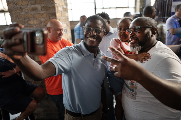 Democratic Wisconsin gubernatorial candidate David Crowley (L) greets supporters at a campaign rally on August 10, 2026 in Milwaukee, Wisconsin.
