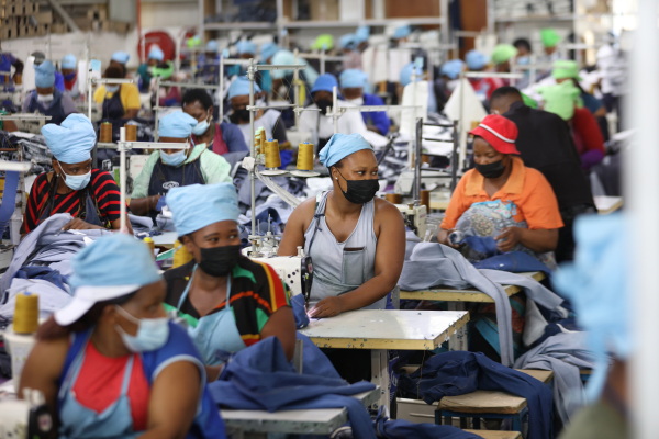 Matumelo Manosa (center) works in a garment factory in Maseru, Lesotho, on Feb. 24, 2022.