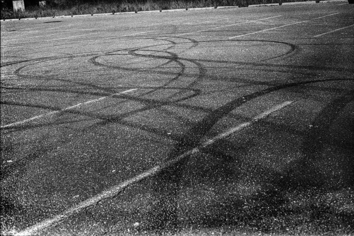 Skid marks left behind in a parking lot during a ride to Long Island.