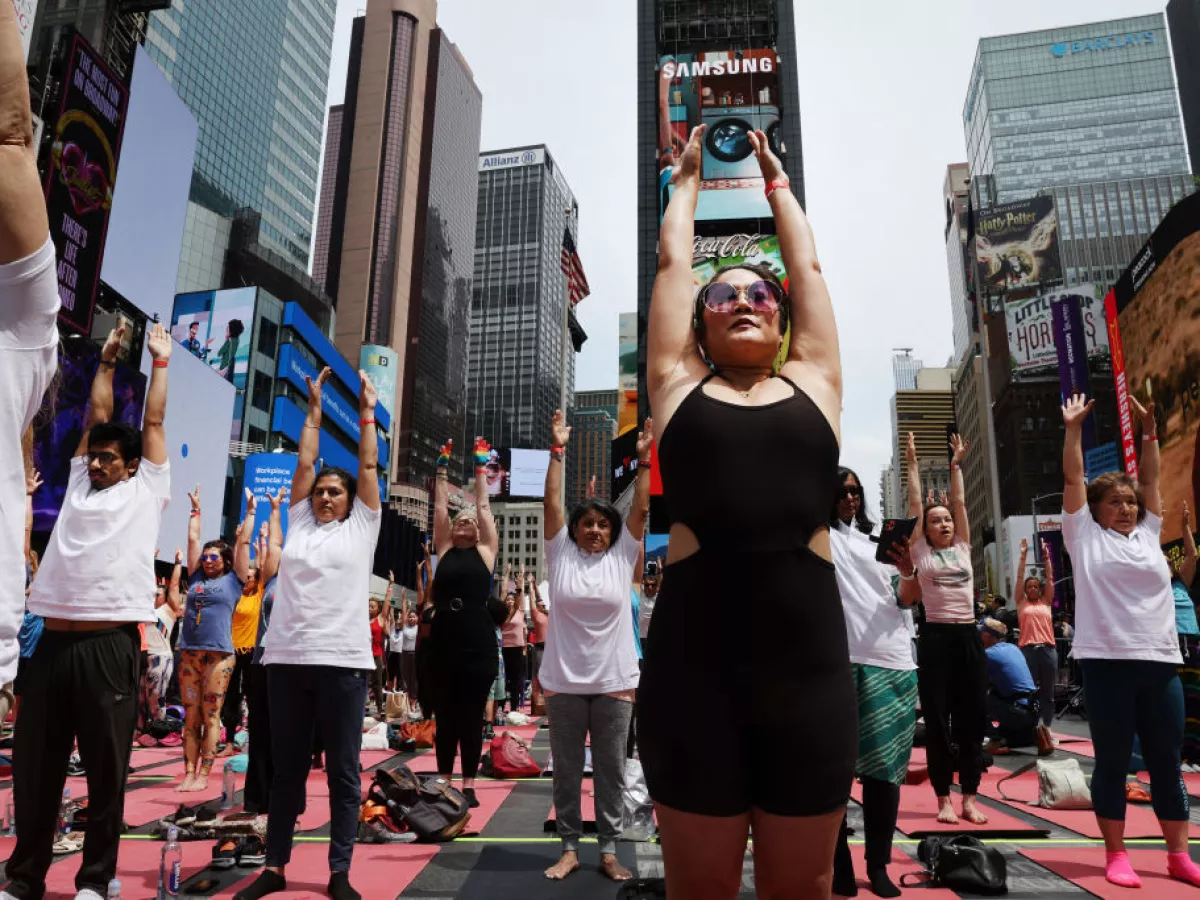 People participate in a mass yoga session on International Yoga Day in Times Square on June 21, 2023 in New York City. The CDC finds about 17% of adults in the U.S. practice yoga.