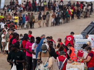 Migrants receive food and aid from the NGO's in El Trampolin Beach on August 14, 2026 in Ceuta, Spain.