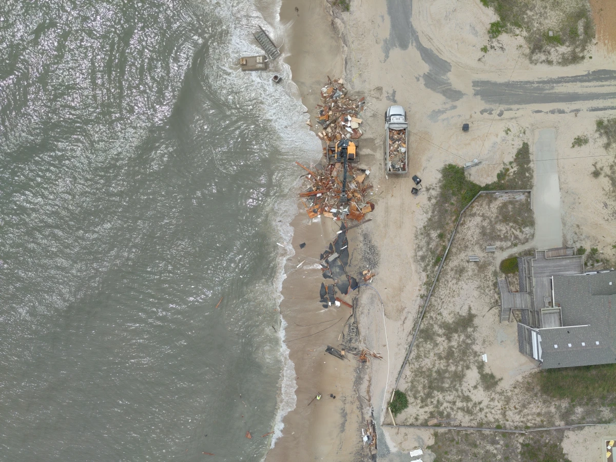 An aerial photo shows debris from a house that collapsed on May 28 in Rodanthe, N.C.