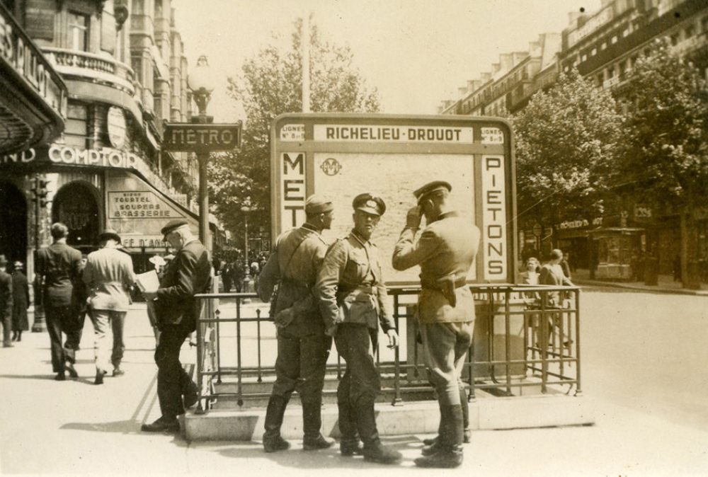 A photograph of German soldiers at the entrance to the Richelieu Drouot metro station in Paris, taken on July 14, 1940.