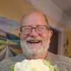 Tom Sinclair today, smiling while he holds a large cauliflower.