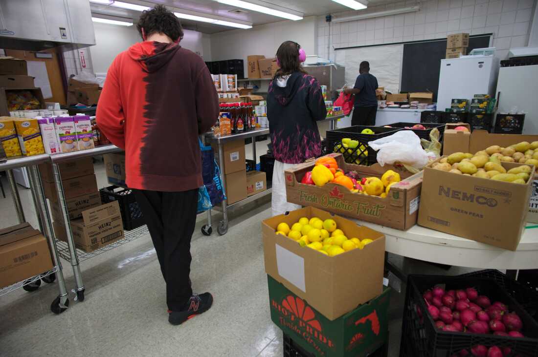 Brashear High School students shop in the pantry, choosing from a selection of fresh produce, canned vegetables, meat products, personal care items and more.