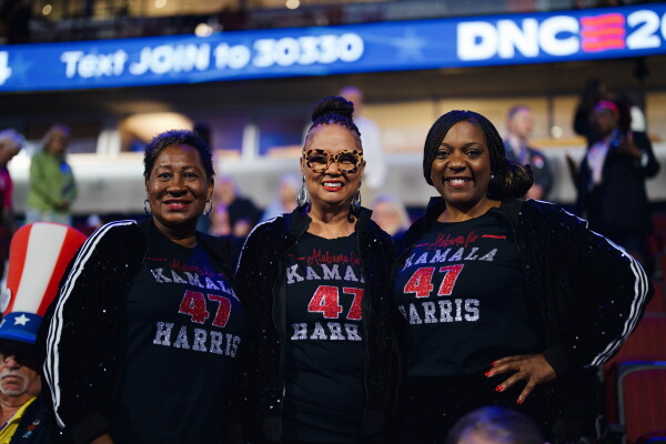 Carolyn Culpepper (left), Sherry McClain (center) and Merika Coleman (right), all delegates from Alabama, are known by the state's Democratic delegation as "The Bling Sisters." Grace Widyatmadja/NPR