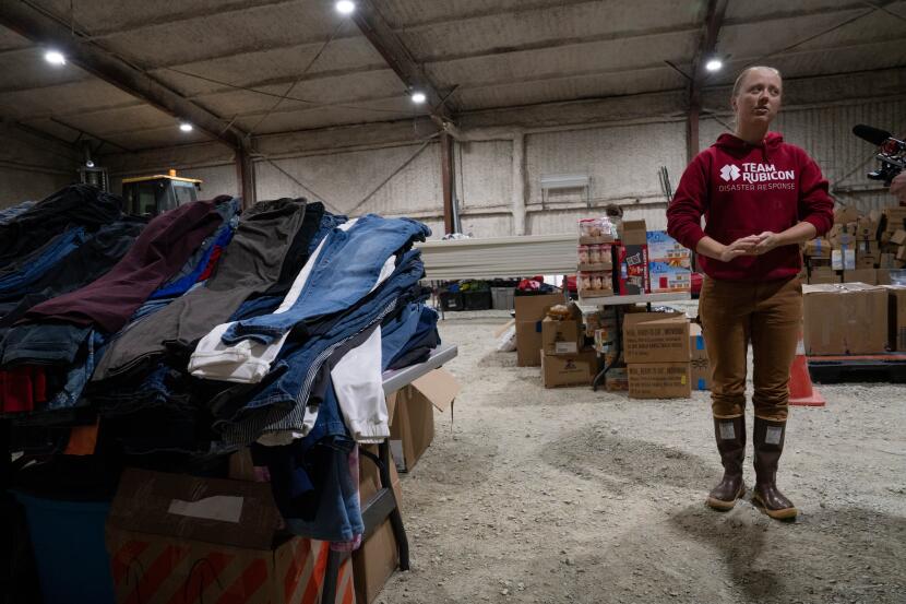 Maggie Coit, a liaison officer with veteran-led nonprofit Team Rubicon, speaks at a city-owned garage being used for staging storm relief supplies in Bethel on Nov. 7, 2025.