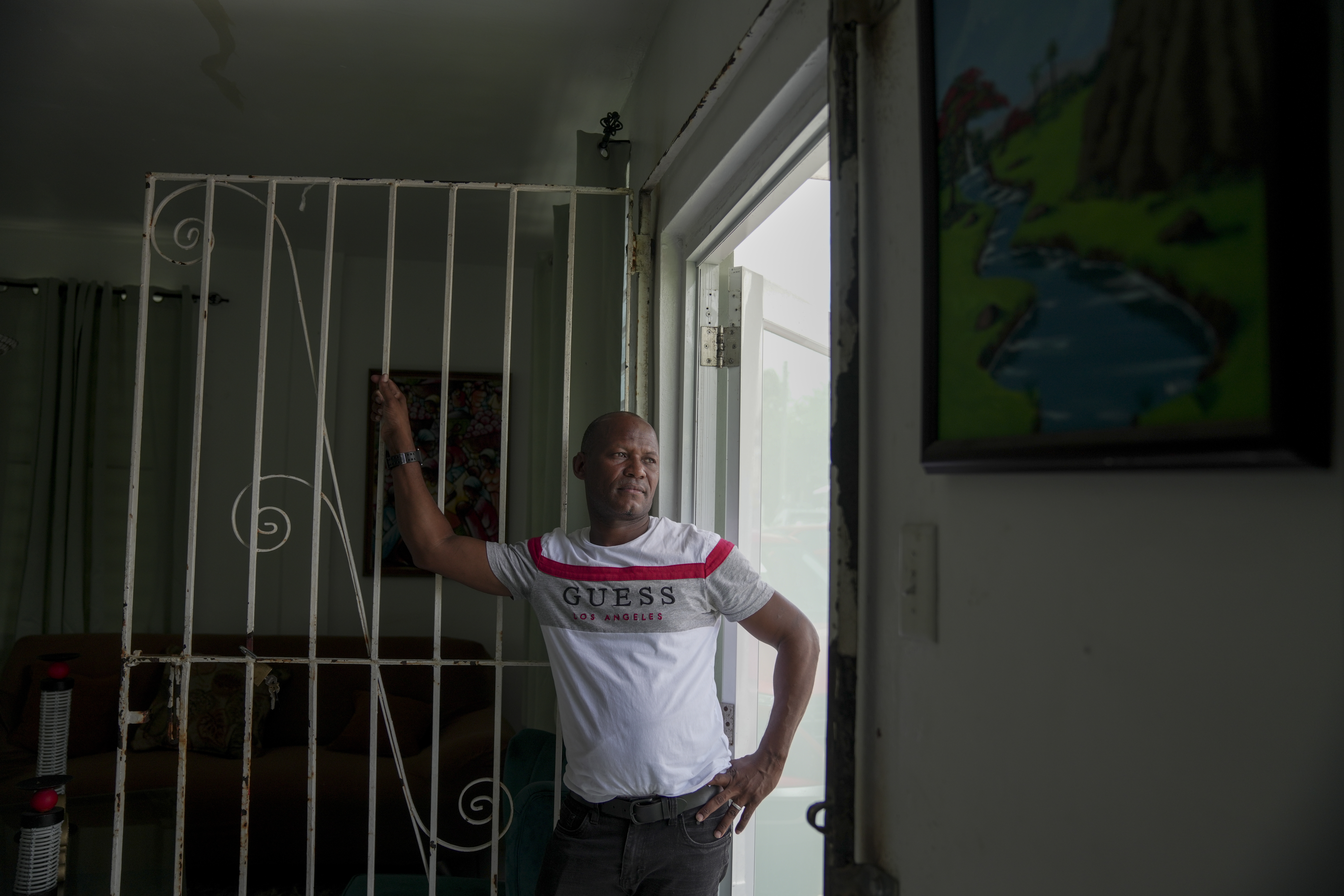 Juan Vega Paredes, a Dominican man who was arrested by immigration authorities in Puerto Rico in January, poses for a portrait in his home in San Juan, Puerto Rico on June 3, 2025.