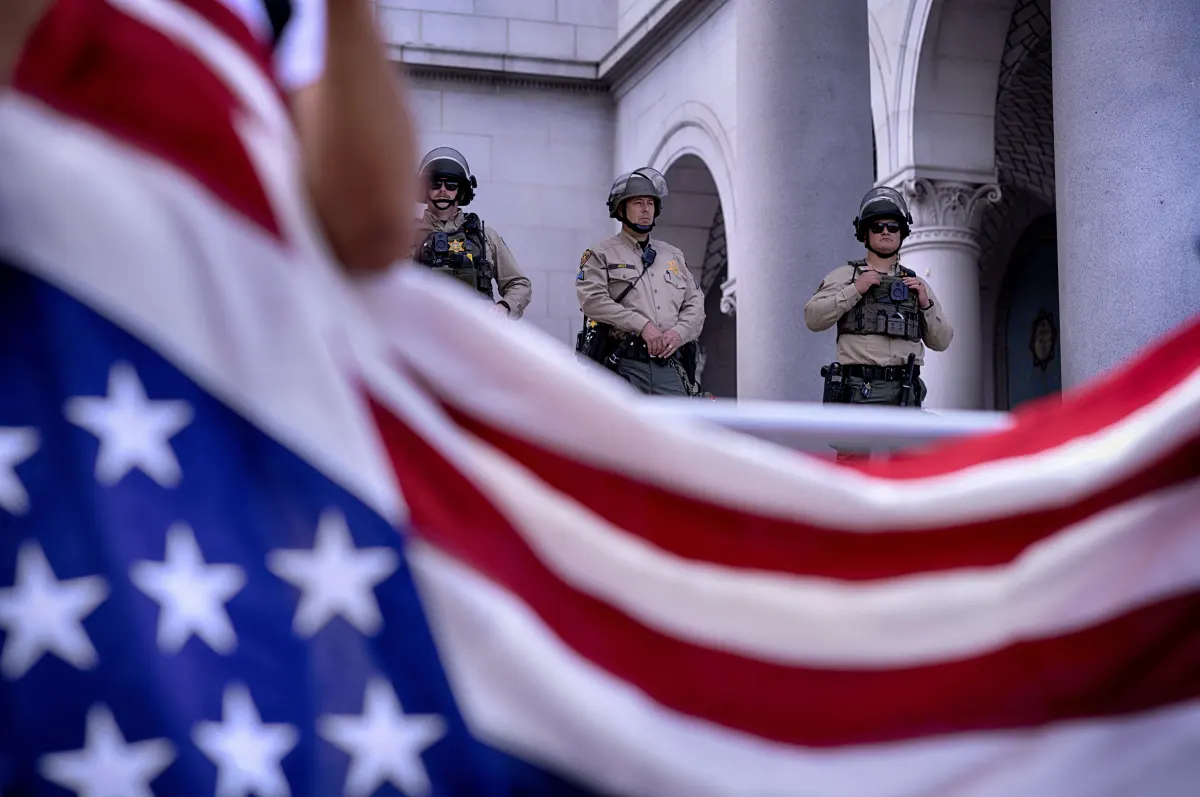 Los Angeles: Los Angeles Sheriff's deputies stand guard on the steps of Los Angeles City Hall as protesters assemble.