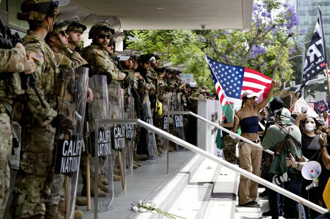 Protesters face california National guard in Los Angeles during a 'No Kings' protest.
