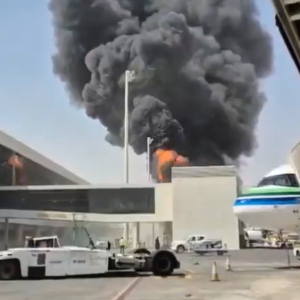 This image from video obtained and verified by AP shows thick black smoke and flames rising from a fire at King Khalid International Airport in Riyadh, Saudi Arabia, Friday, Oct. 9, 2026.