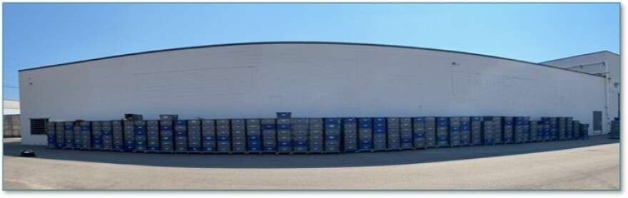 Archival material from Midland's Doan Historical Center, in bins, at Prism Specialties before being treated