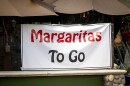 Sign at restaurant offering Margaritias To Go 