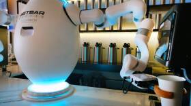 A two-armed robot called "ADAM" prepares a cup of coffee for a customer at Botbar coffee shop on May 31, 2023 in Brooklyn, New York. (Spencer Platt/Getty Images)