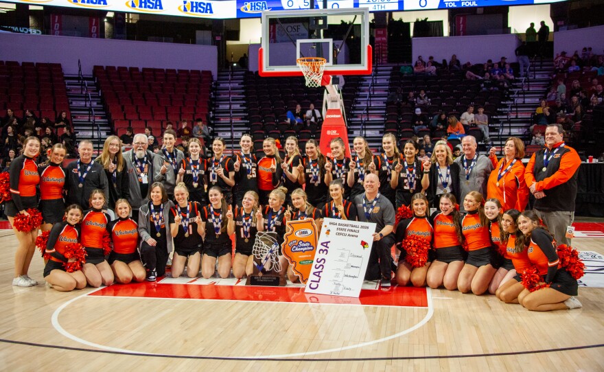 Girls high school basketball players inside an arena