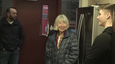 Victoria Lydle speaks with public safety officials who rescued her after she was mauled by a bear in July. Lydle met with over a dozen responders at Fire Station 14 in East Anchorage on Nov. 25.